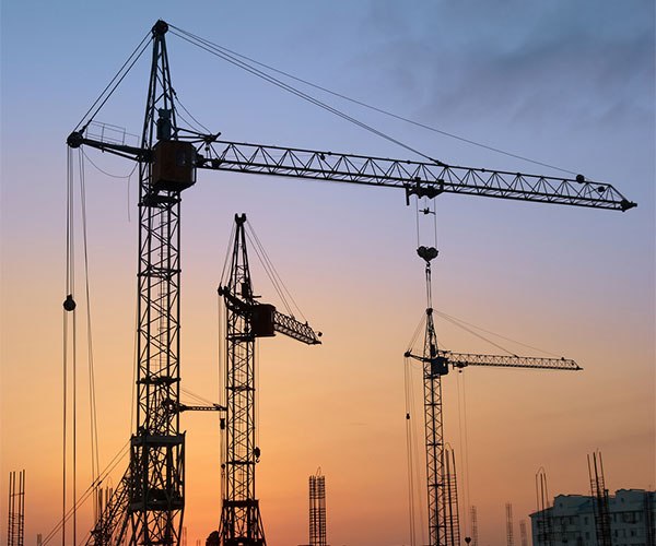 Large cranes during sunset